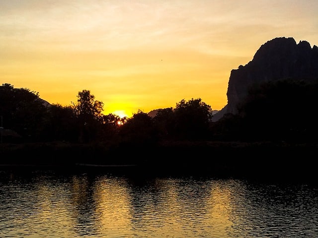 A picture of the river in Vang Vieng at sunset. A great sight to see while backpacking Vang Vieng!