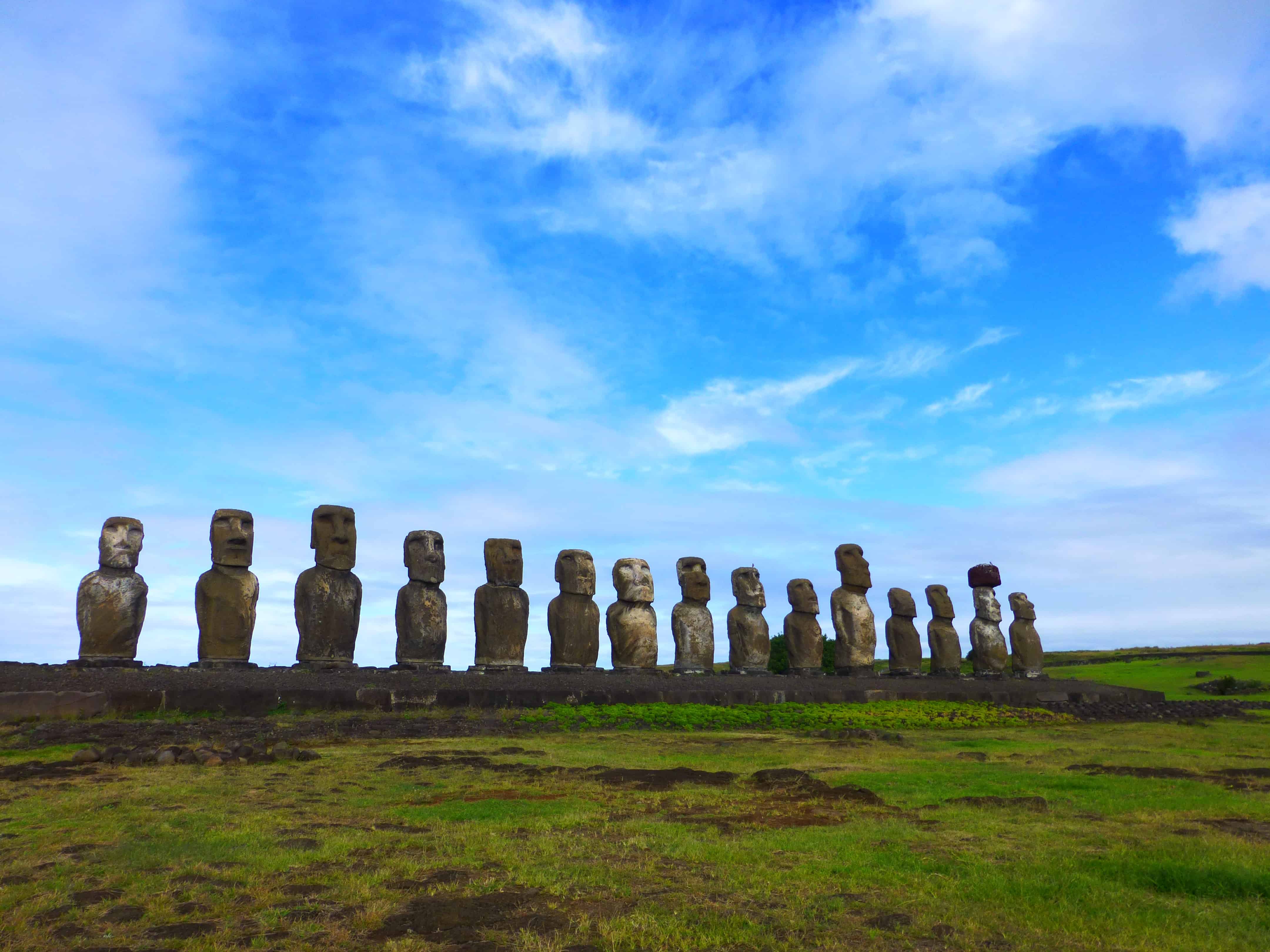 The moai in all their glory, standing tall and beautiful in front of a blue sky