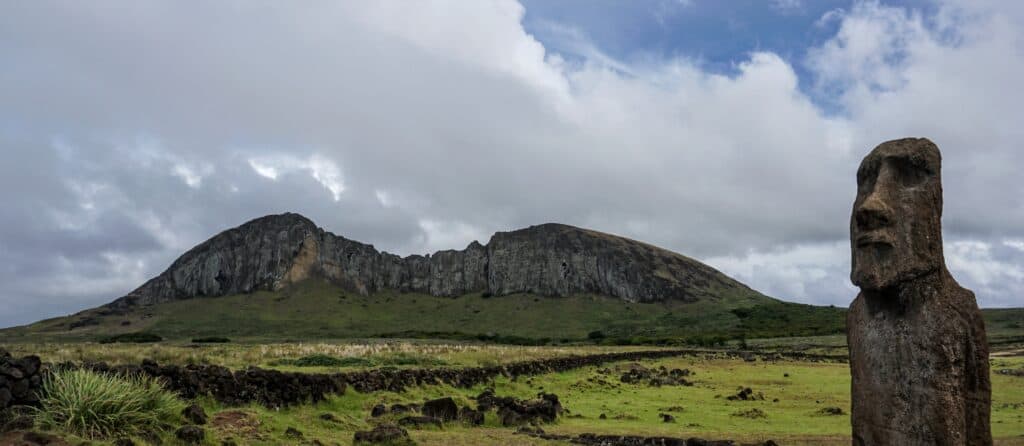 A photo taken which captures the summit and the moai in one image.
