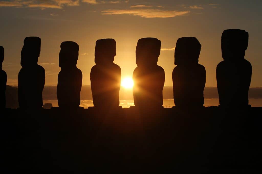 Another picture of the moai with the sun setting