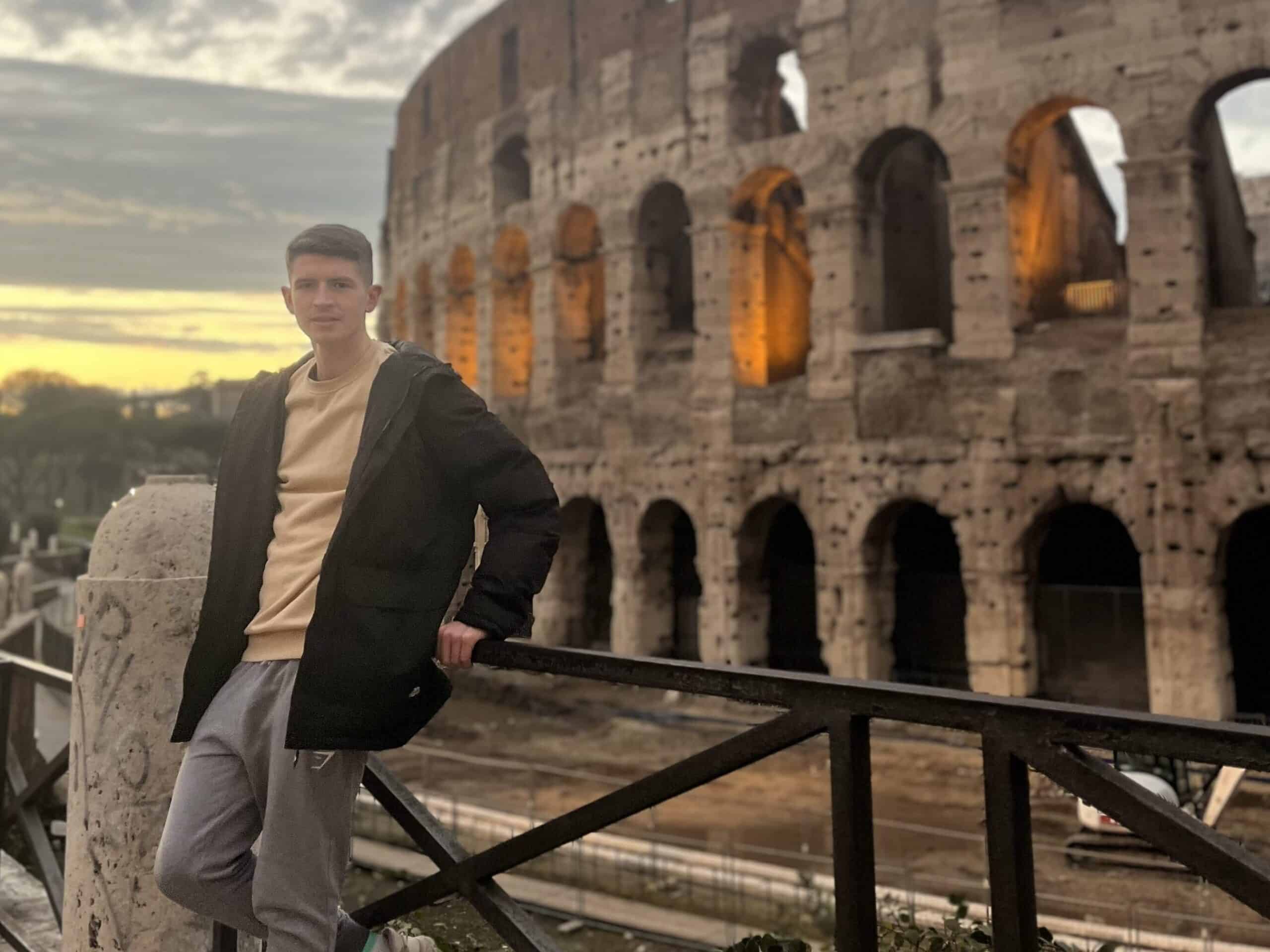 A picture of me outside the Colosseum at sunset.