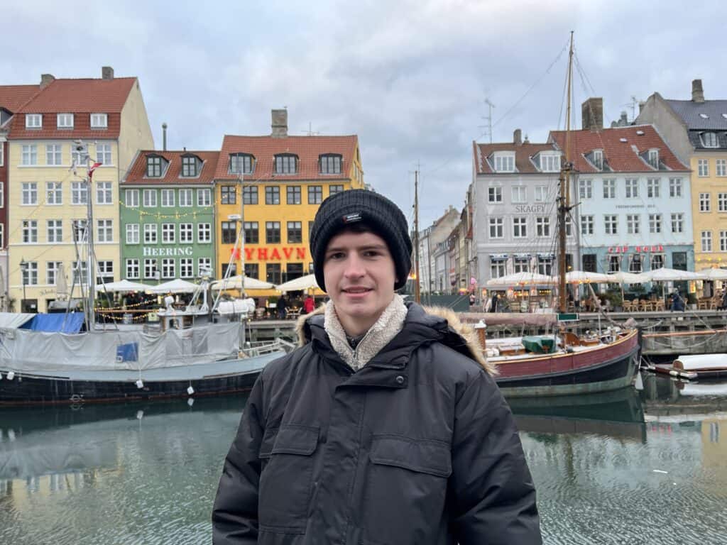 A picture of me at the coloured houses at Nyhavn in Copenhagen in January. 