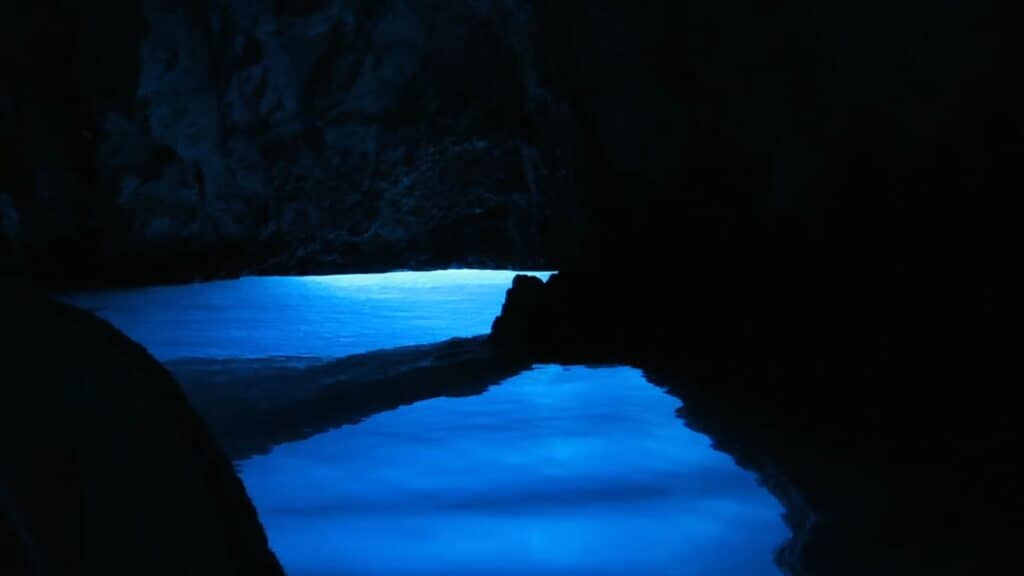 A picture inside the Blue Cave where the blue is illuminating the whole picture. 