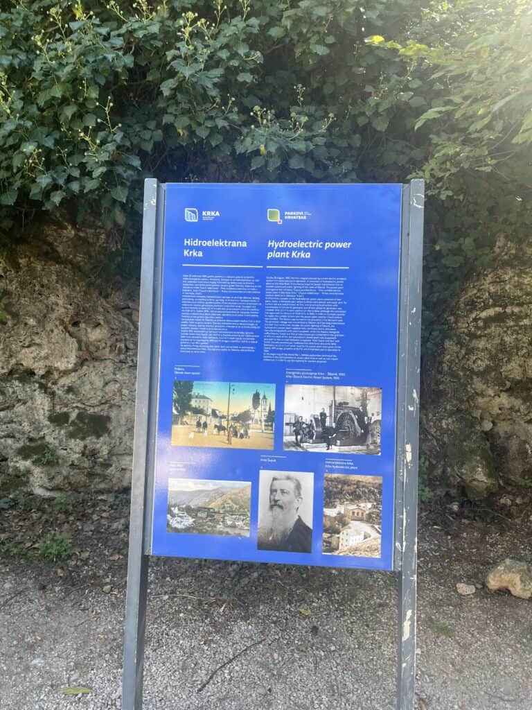 A picture of a sign providing information about the hydroelectric power plant in Krka.